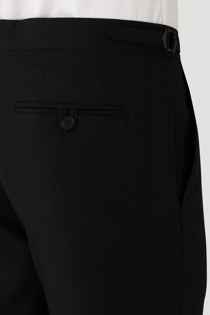 Black Solidus Evening Trouser from Joe Black Menswear - Detail Rear Pocket with Button and Adjustable Waistband Model Image - PJEN0007T2 - BLACK - FCK410